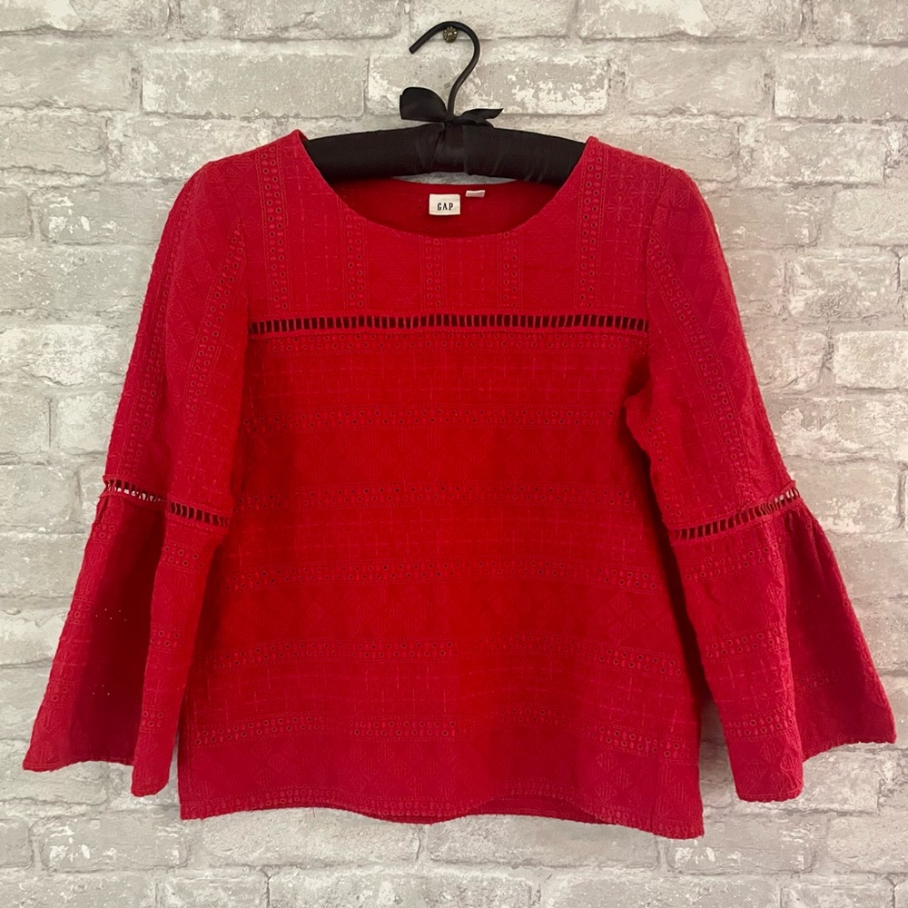 Eyelet style red cotton top with flare sleeves from the Gap.